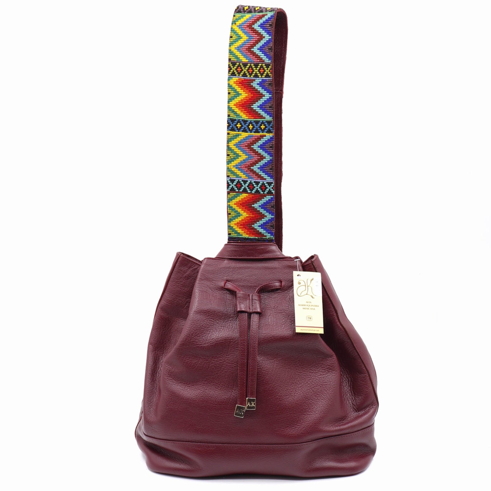 mk-1321 back pack de piel con asa de chaquira artesanal de grecas